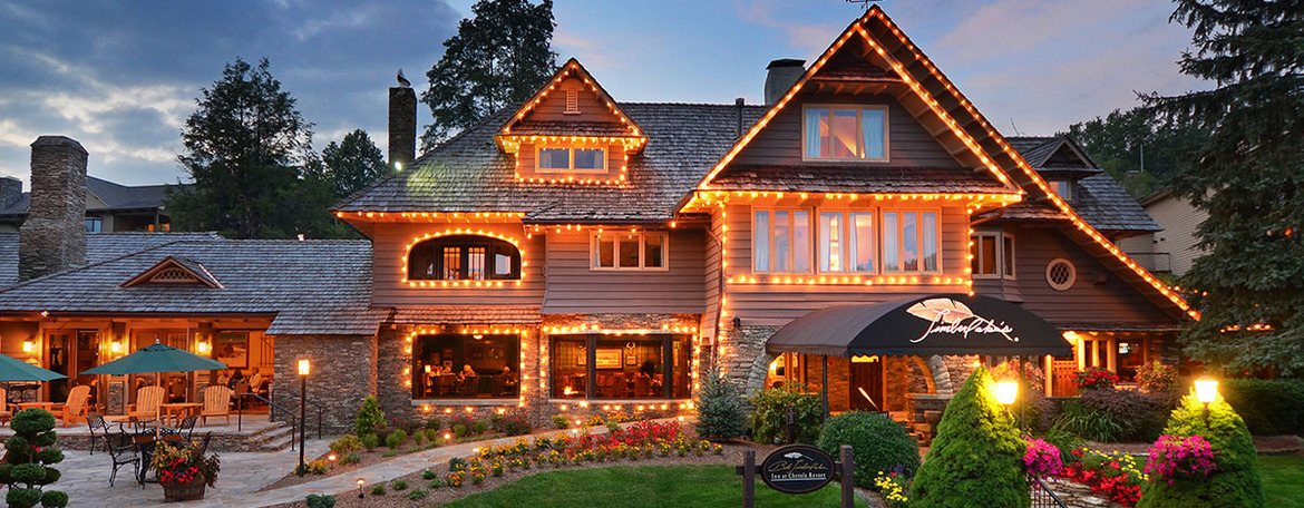 image of chetola resort in the evening with outdoor lights outlining the roofline of lodge. Site of CapDev fall 2025 workshop